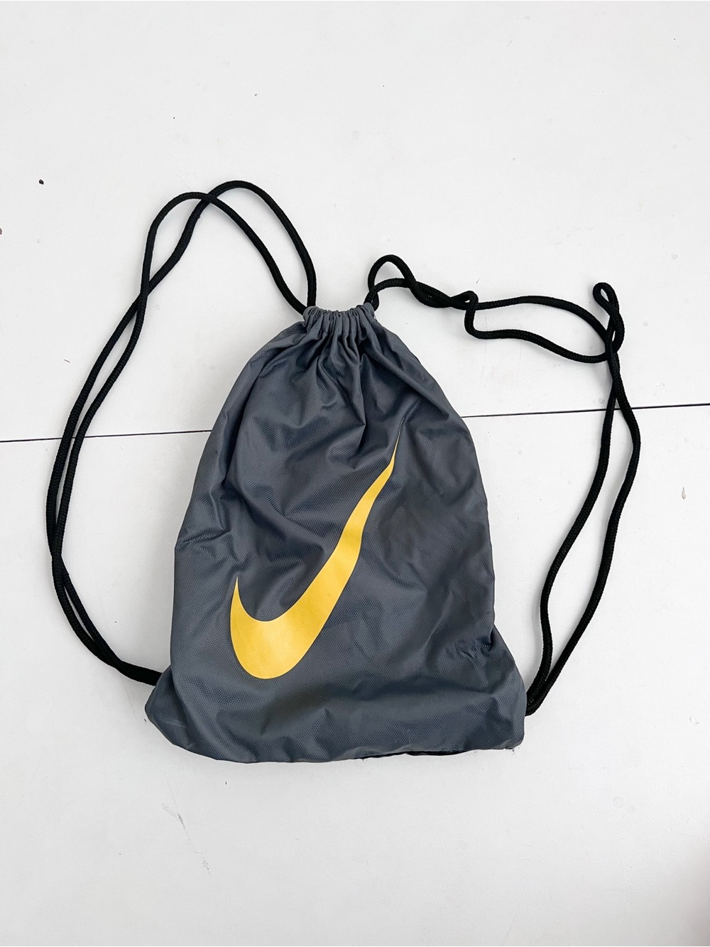 Nike Gray Drawstring Backpack with Yellow Swoosh